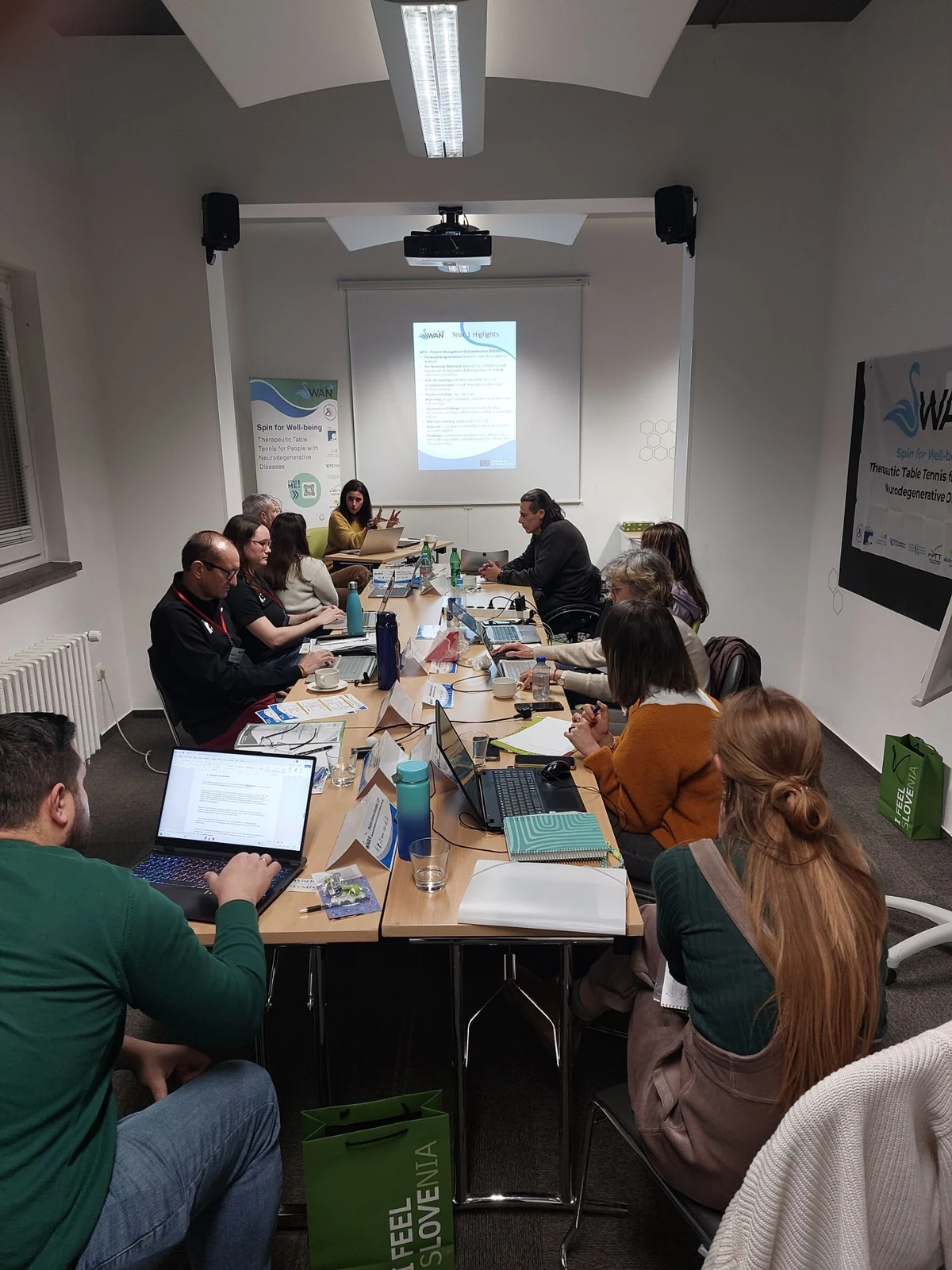 Partners around the meeting table during a Year One highlights presentation